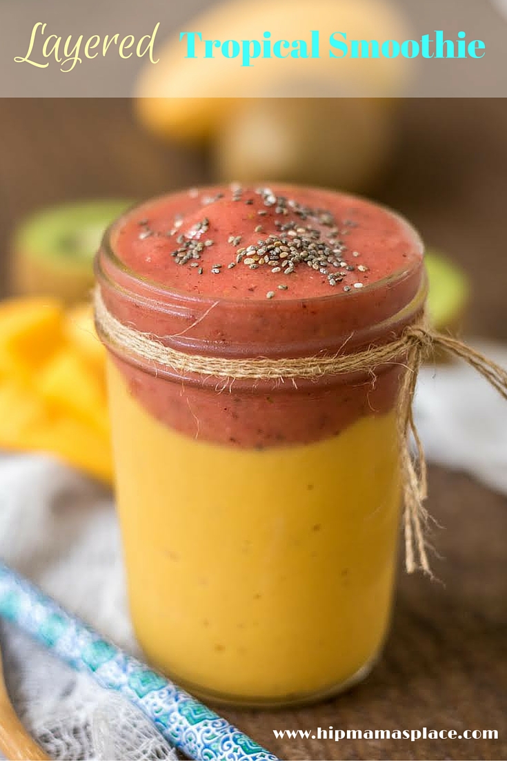 Layered tropical smoothy with mango and strawberry