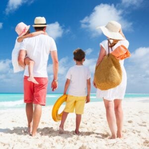 family enjoying a summer day at the beach