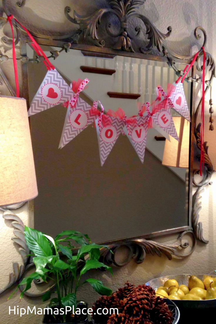 Make your own easy DIY Valentine's Love banner. Go get your FREE printable at www.hipmamasplace.com!