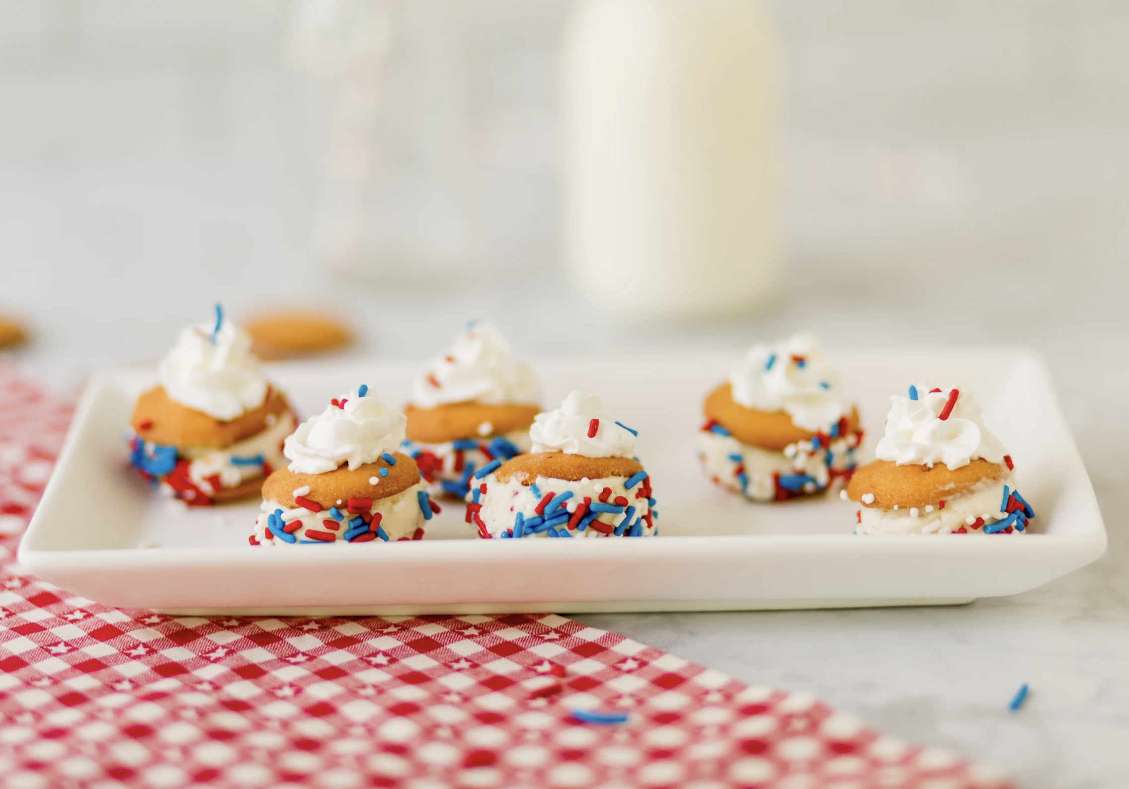 Patriotic, delicious and refreshing, these Red, White and Blue Mini Ice Cream Sandwiches with NILLA Wafers are the perfect summer snacks or desserts for your next summer party!