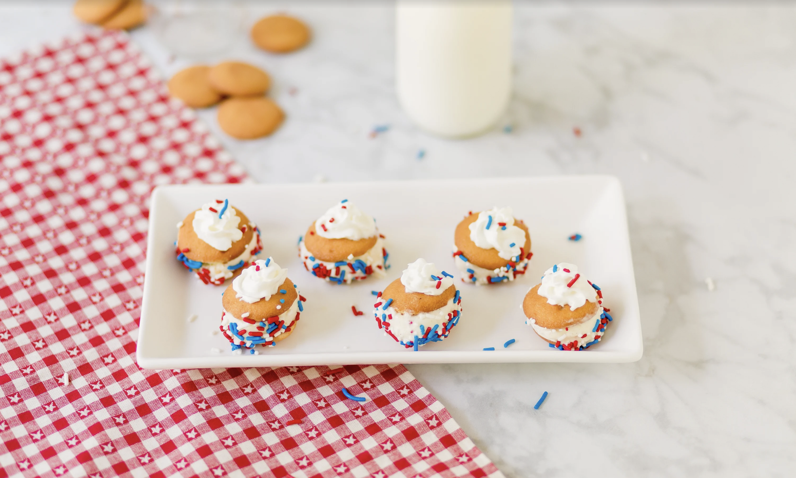 Patriotic, delicious and refreshing, these Red, White and Blue Mini Ice Cream Sandwiches with NILLA Wafers are the perfect summer snacks or desserts for your next summer party!