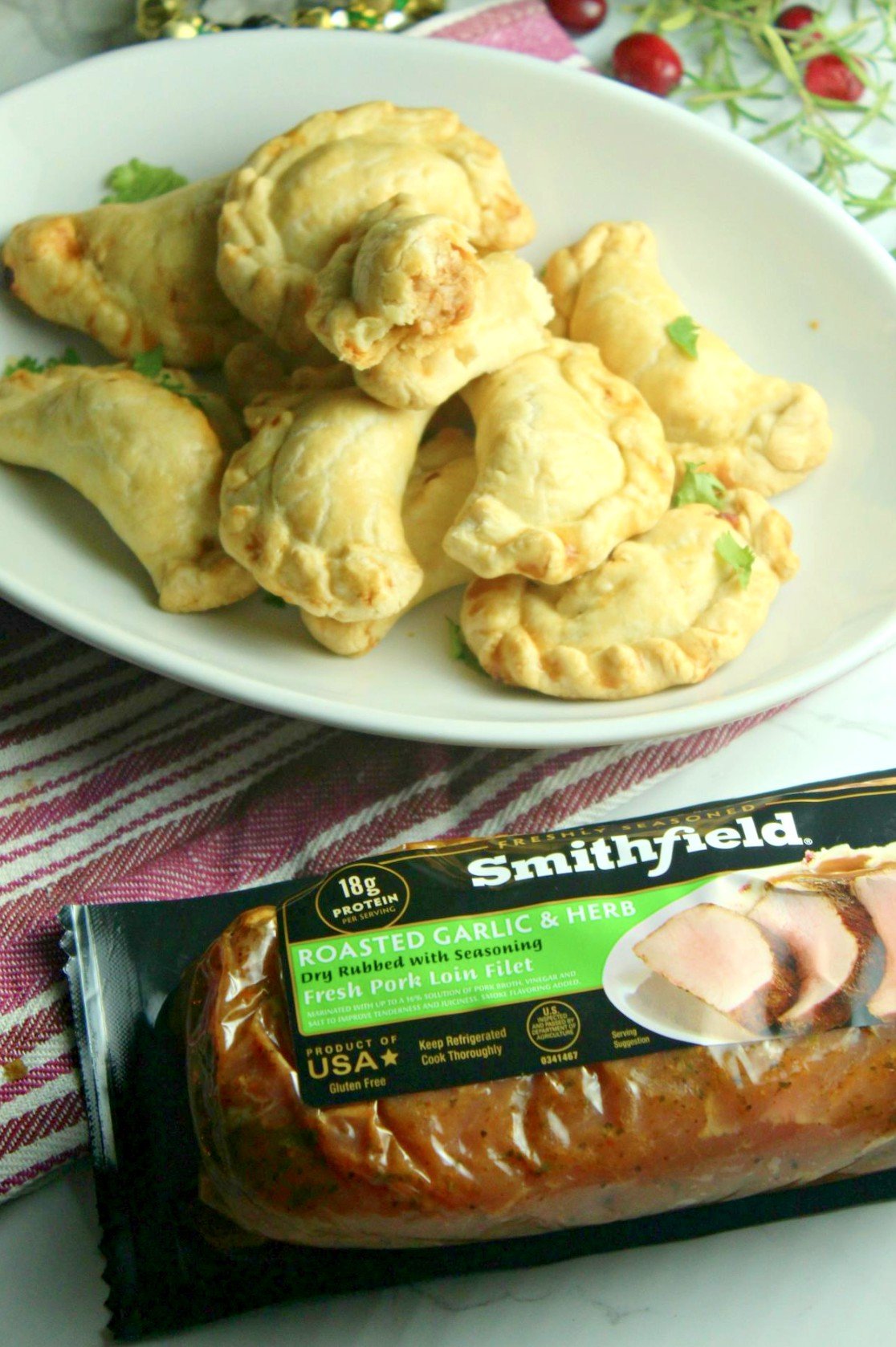 AD Festive Pork and Cheese Empanadas using Smithfield Roasted Garlic & Herb Marinated Fresh Pork Loin Filet. Full blog post here: https://www.hipmamasplace.com/festive-pork-and-cheese-empanadas/