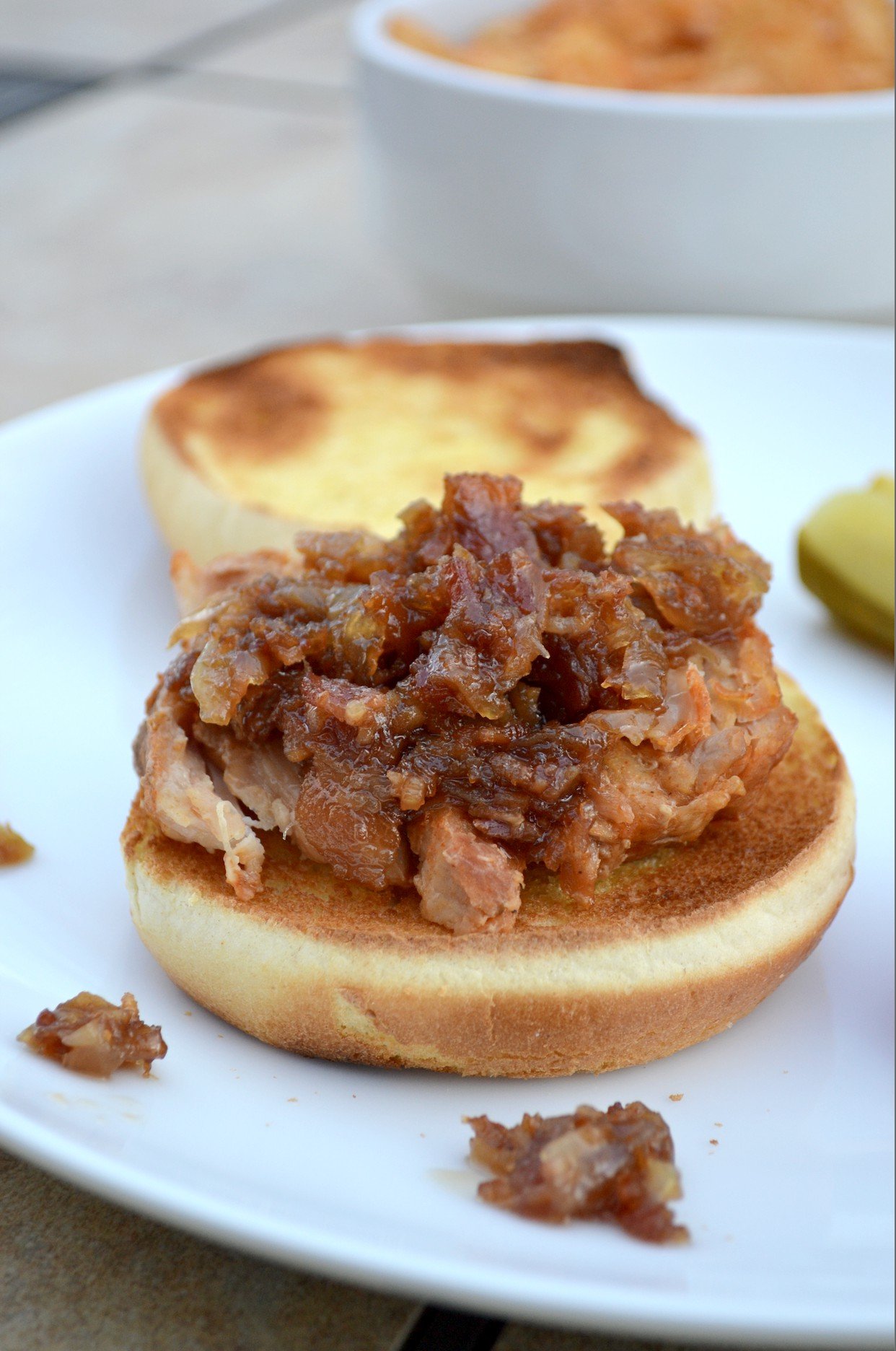 Pork Loin filet slow cooker recipe with bacon onion jam on potato buns 