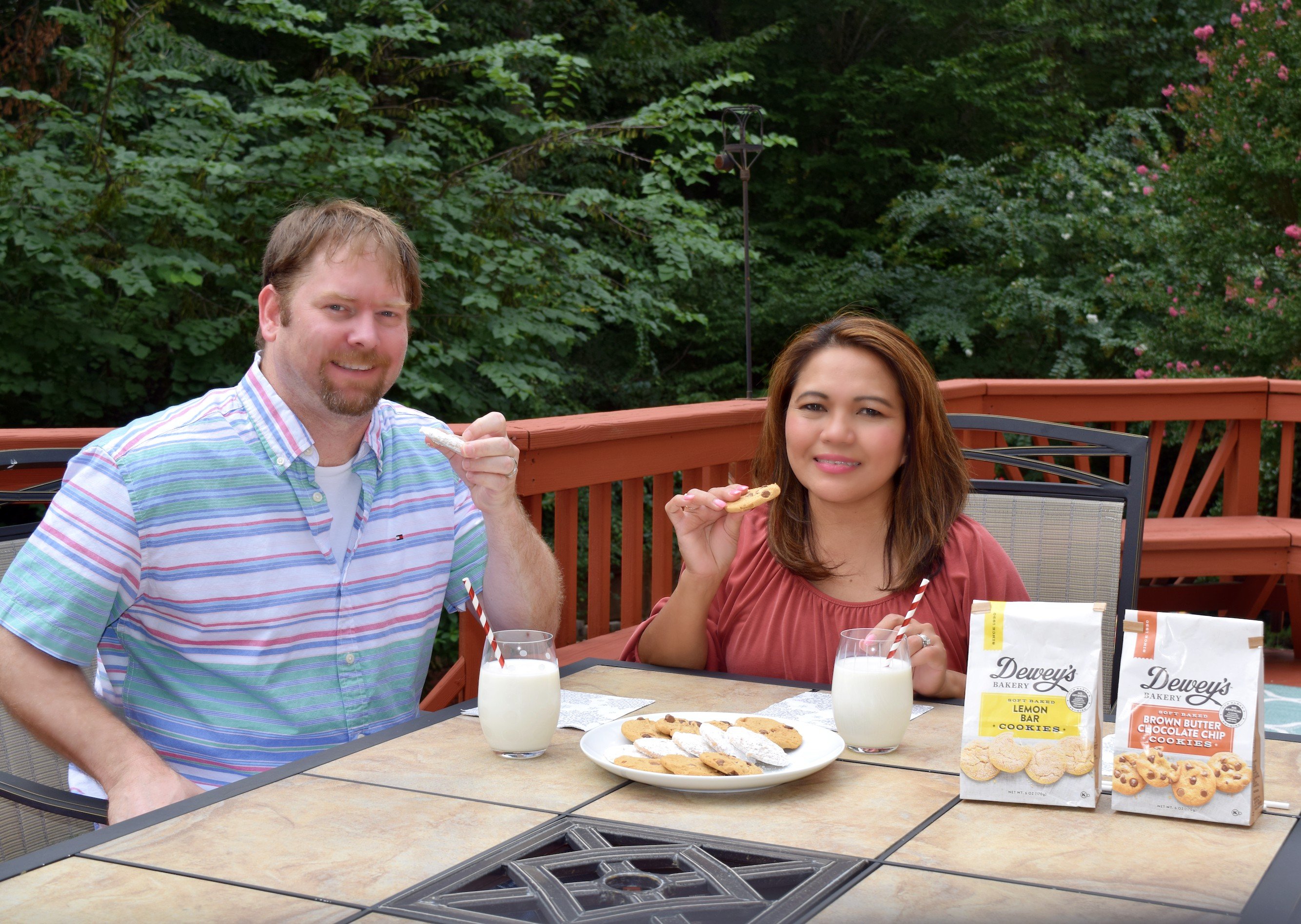 Happy husband and wife enjoying Dewey's Bakery Soft Baked Cookies