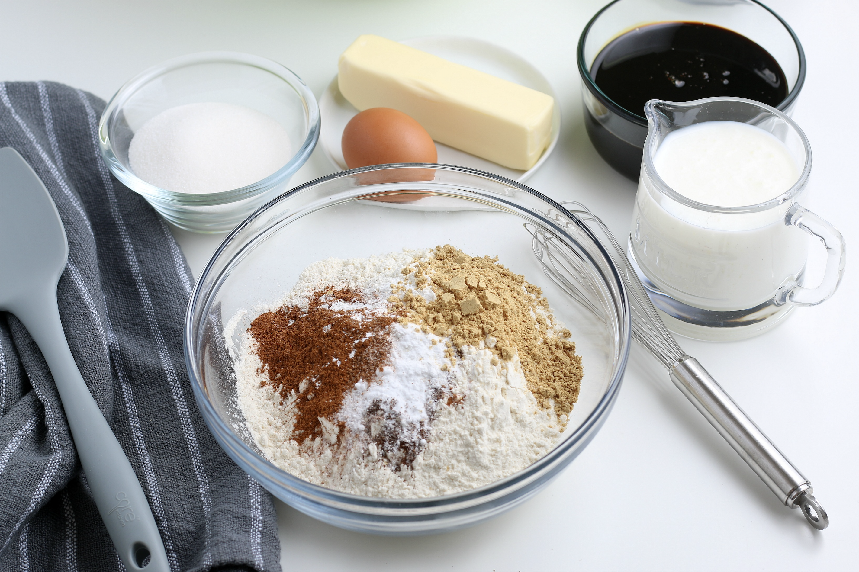 Mixing the flour and spices in a glass bowl.