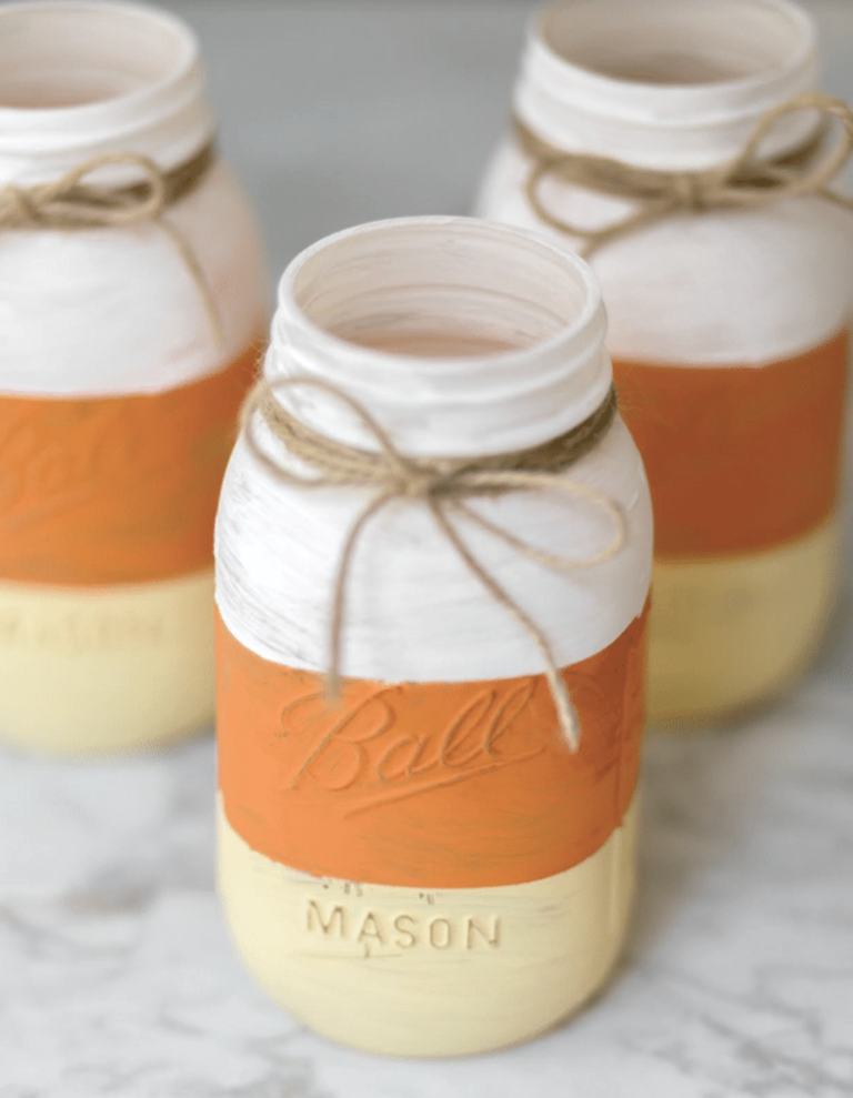 Budget-friendly dollar store fall decor with fall wreaths, autumn decorations, and stacked pumpkins for porch.