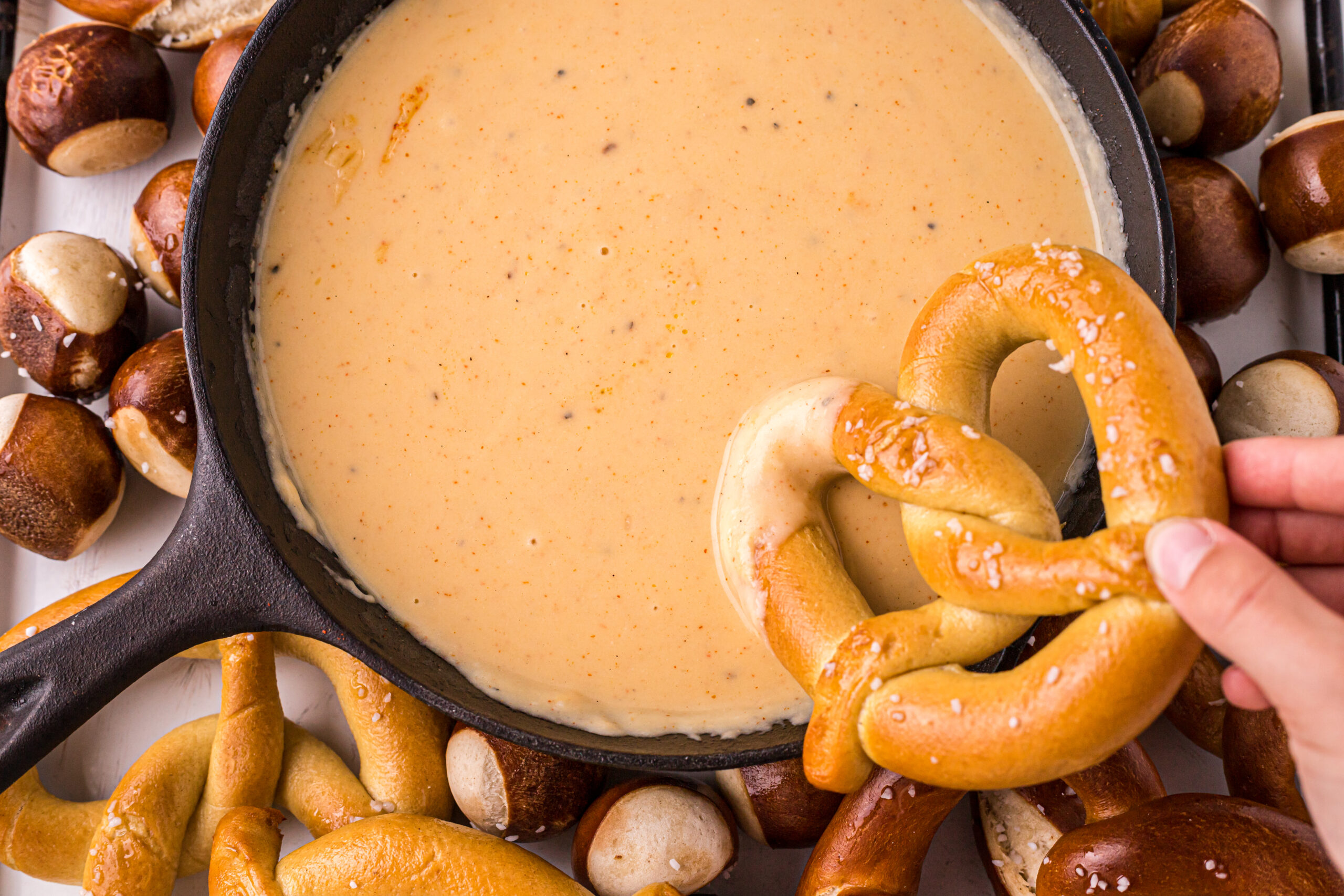 pretzels dipped in beer cheese dip 