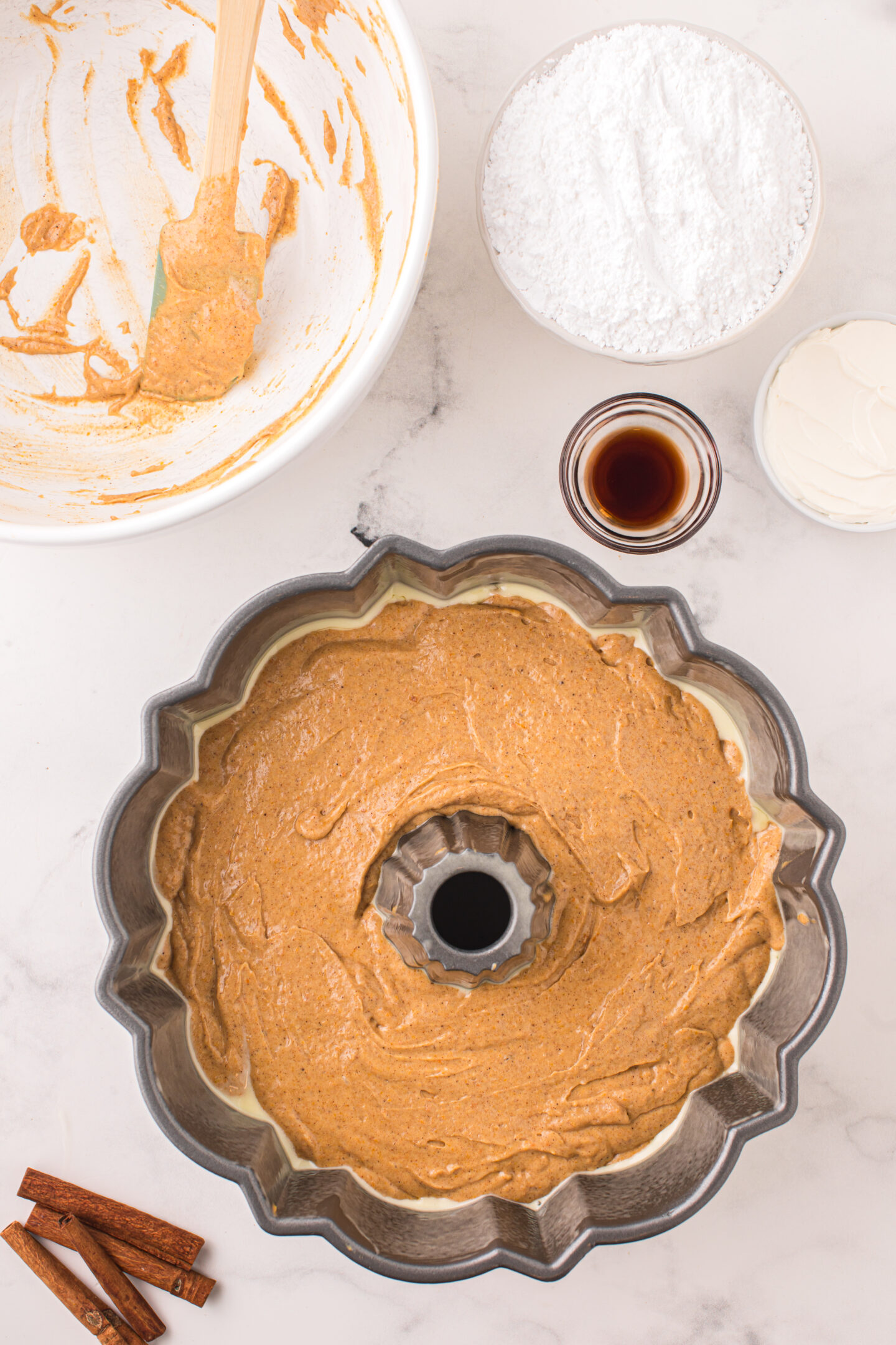 Putting the batter in the bundt pan. 