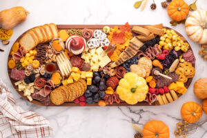 The Ultimate Fall Charcuterie Board with a Pumpkin-Shaped Cheese Ball
