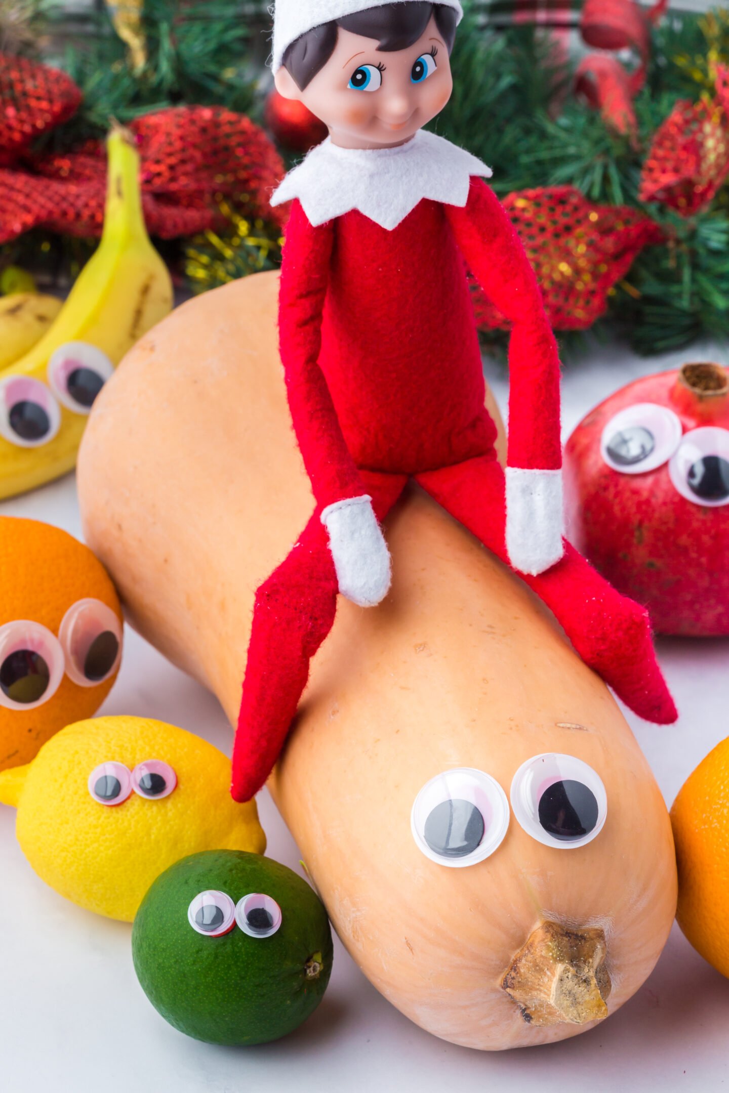 Elf on the Shelf googly eyes on fruit prank