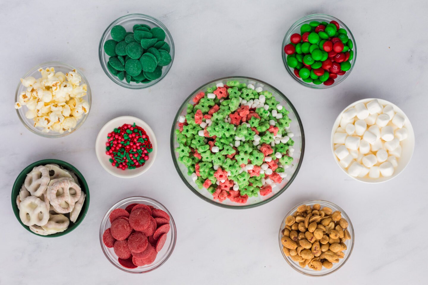 Ingredients for Elf on the Shelf Mischief Munch laid out on a white kitchen countertop