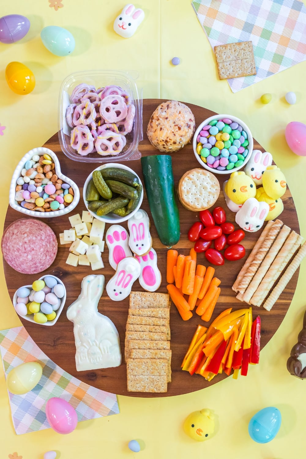 ingredients for Easter snack board including candy vegetables and cheese