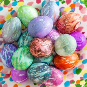 silk dyed eggs in a decorative bowl with colorful patterns for Easter