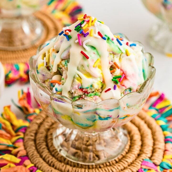 Cake Batter Ice Cream with Magic Shell served in a glass dessert bowl and loaf pan with rainbow sprinkles. A creamy homemade funfetti ice cream recipe and colorful summer dessert perfect for birthdays, celebrations, and family gatherings.