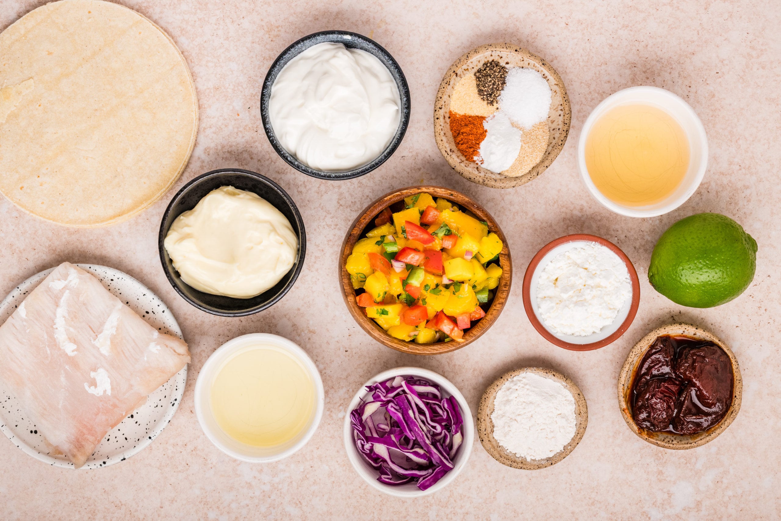 Ingredients for beer battered cod tacos with mango salsa and chipotle sauce
