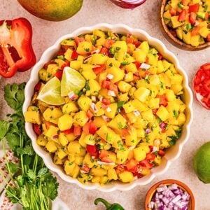 Easy mango salsa recipe with ripe mango, red bell pepper, red onion, cilantro, jalapeño and lime