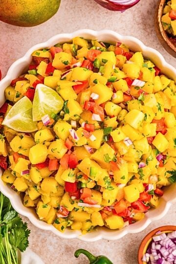 Easy mango salsa recipe with ripe mango, red bell pepper, red onion, cilantro, jalapeño and lime