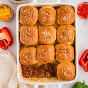 Easy Sloppy Joe casserole with seasoned ground beef, melted cheddar cheese and buttery sesame slider buns