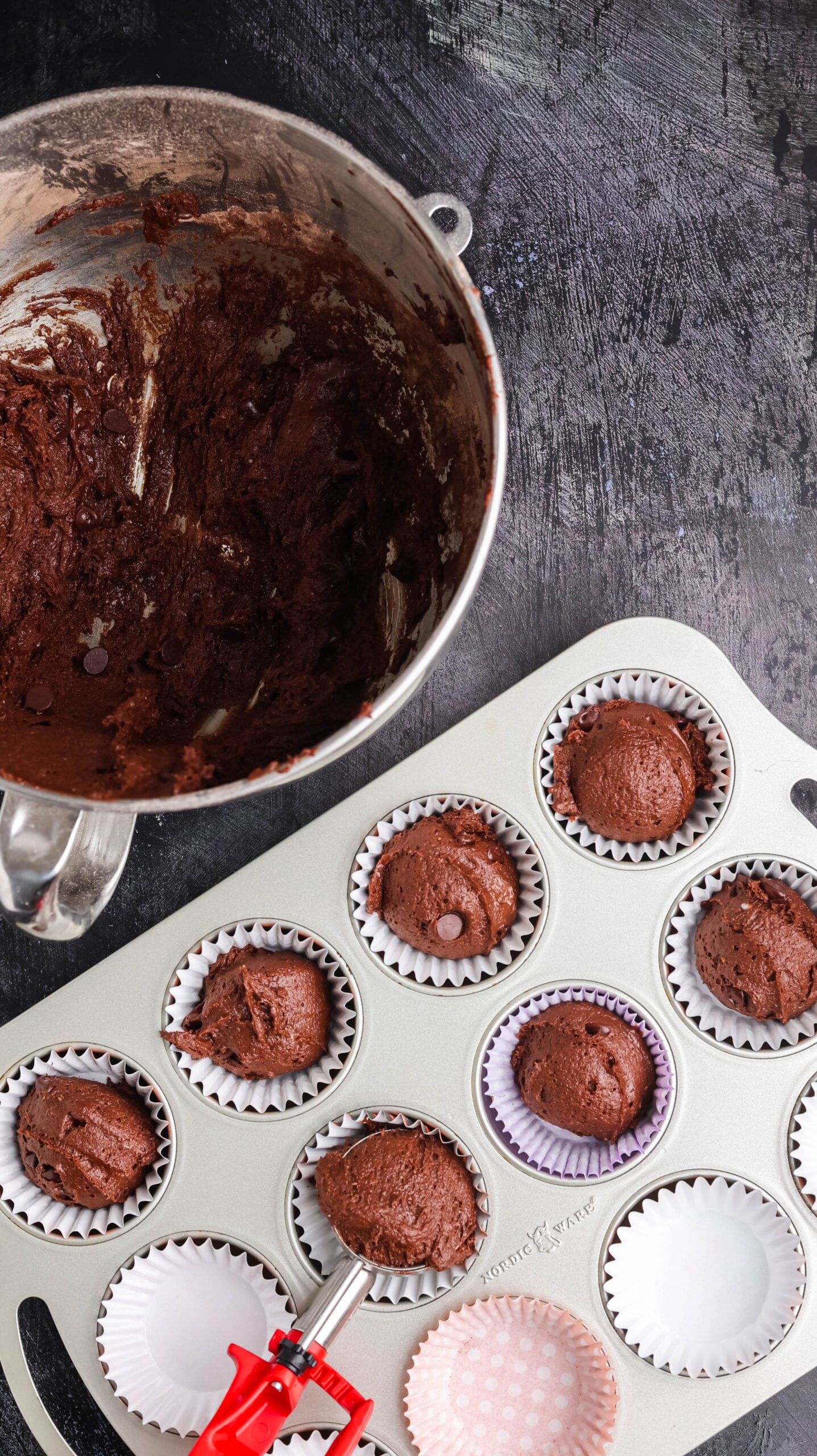 Chocolate Halloween cupcake batter portioned into paper liners