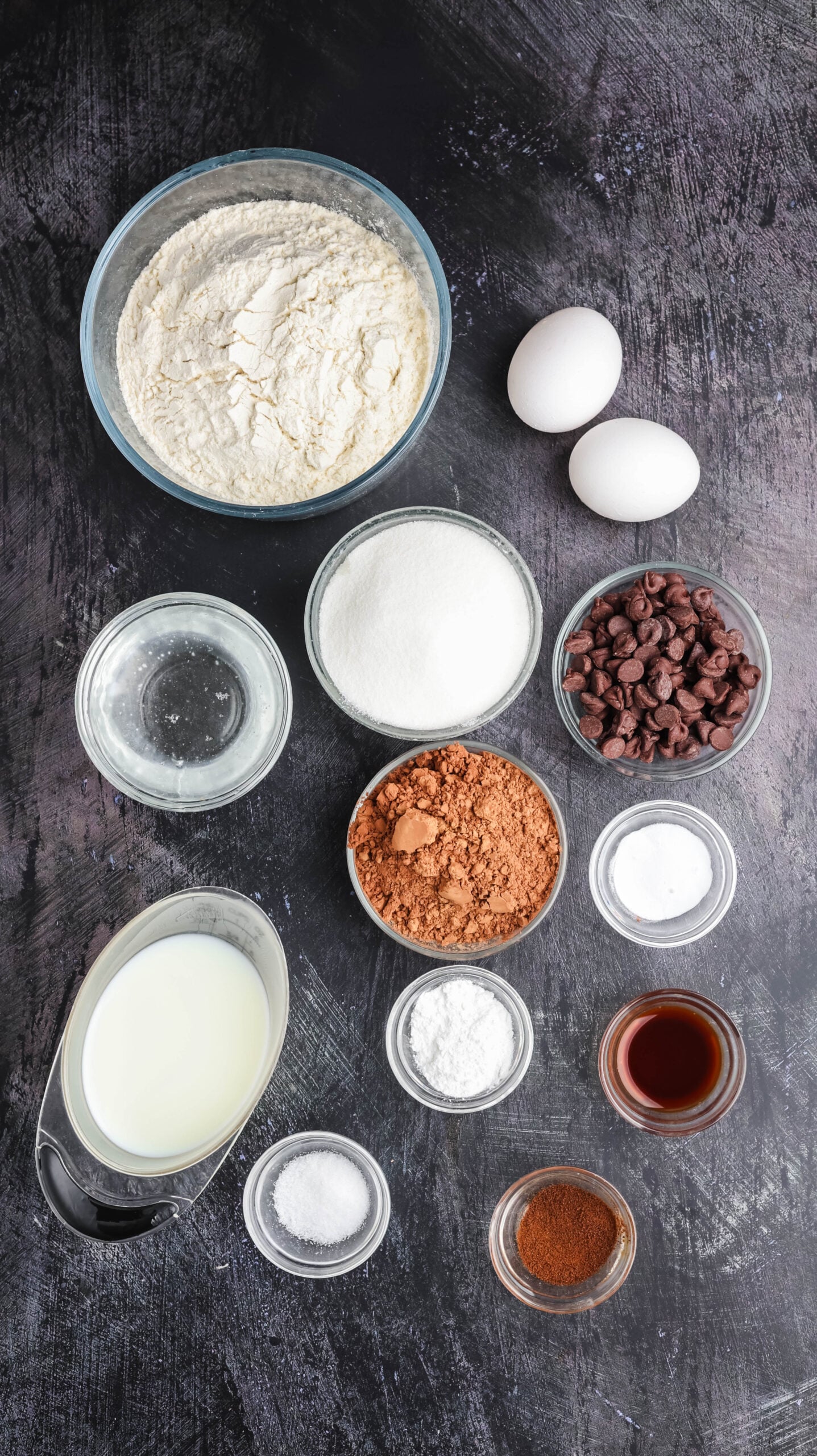 Ingredients for homemade chocolate Halloween cupcakes and witch hat decorations