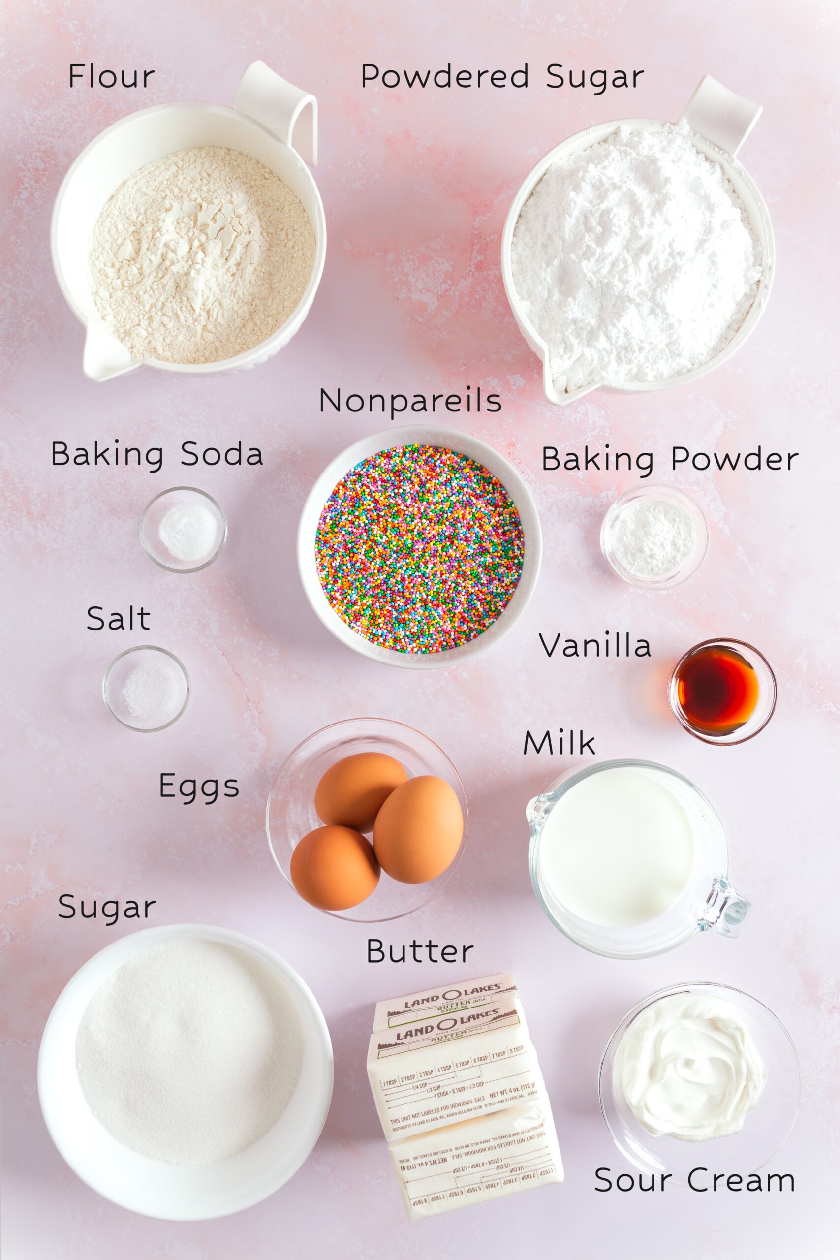 Ingredients for homemade vanilla dot cakes arranged on a kitchen counter