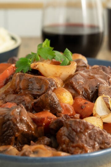 Beef bourguignon with mushrooms, pearl onions, and carrots in red wine sauce